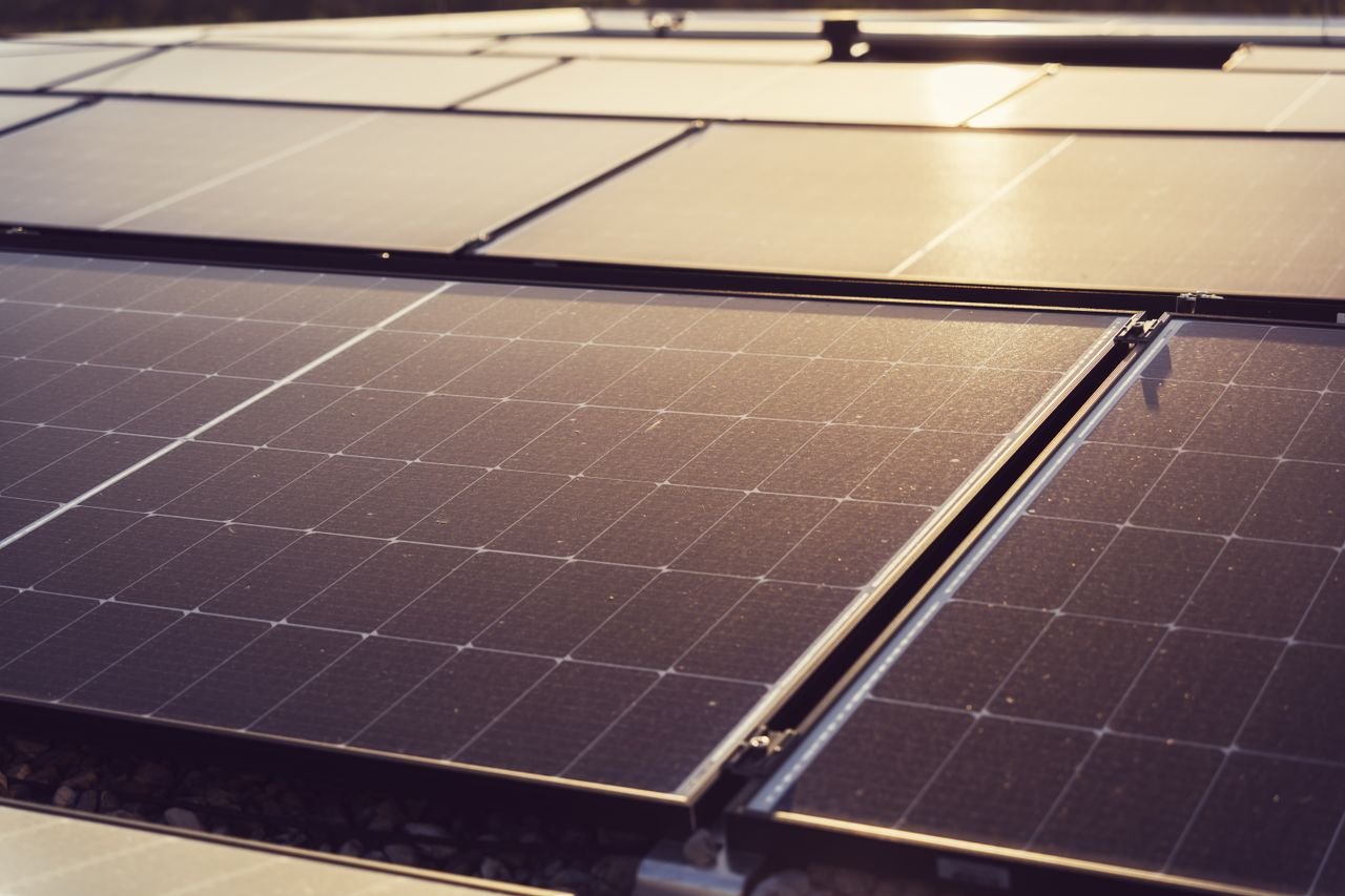 The Art of Drawing Readers In: Your attractive post title goes here Detailed view of solar panels capturing sunlight, highlighting renewable energy technology.