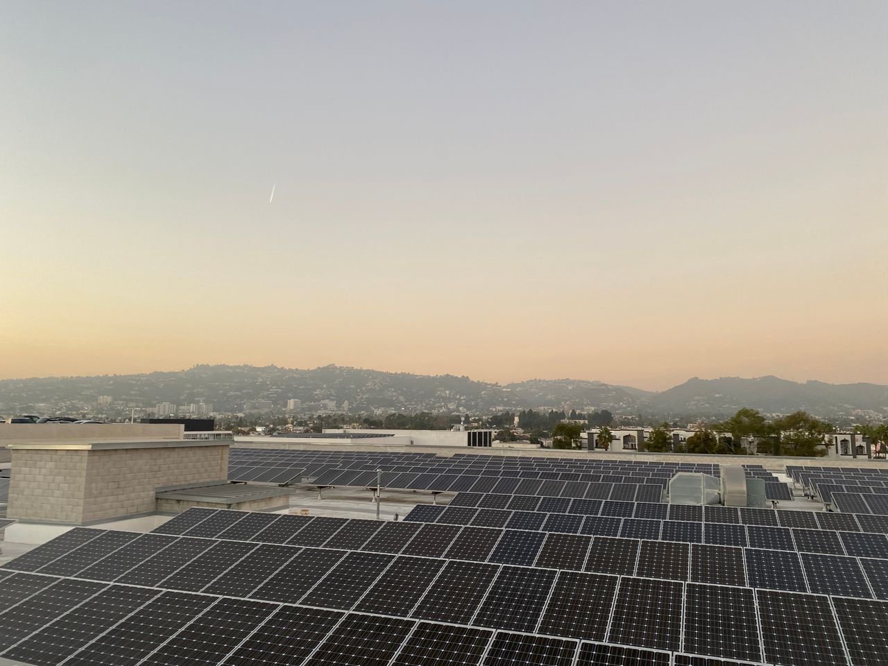 services-01 Scenic view of solar panels on a rooftop at sunset in Los Angeles, California.
