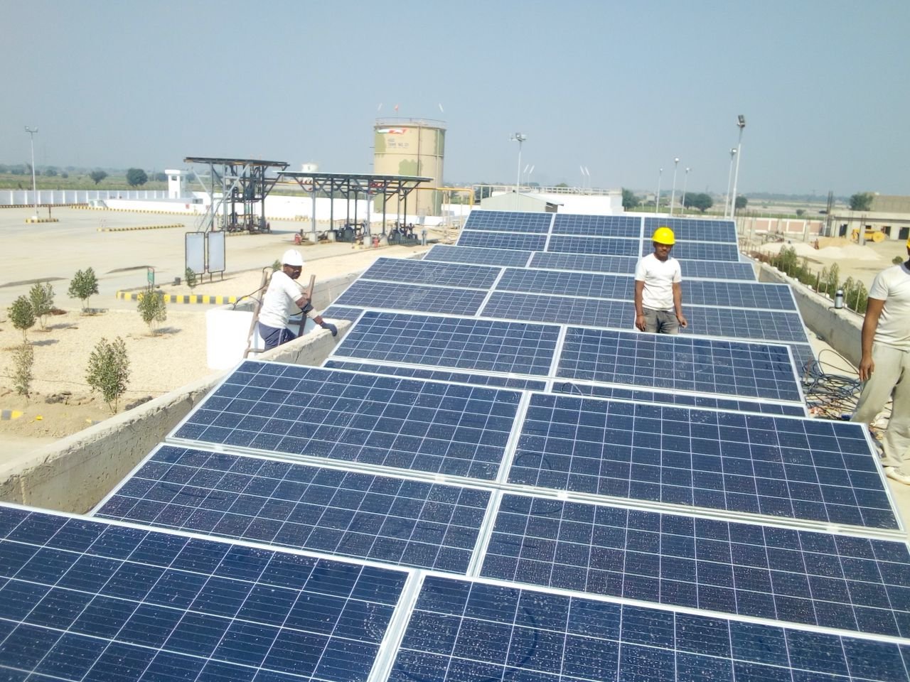 Crafting Captivating Headlines: Your awesome post title goes here Workers installing solar panels on a rooftop for renewable energy generation.